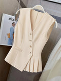 Women’s clothing featuring a V-neck, sleeveless design with pleats at the hem. Perfect for casual or professional settings with
